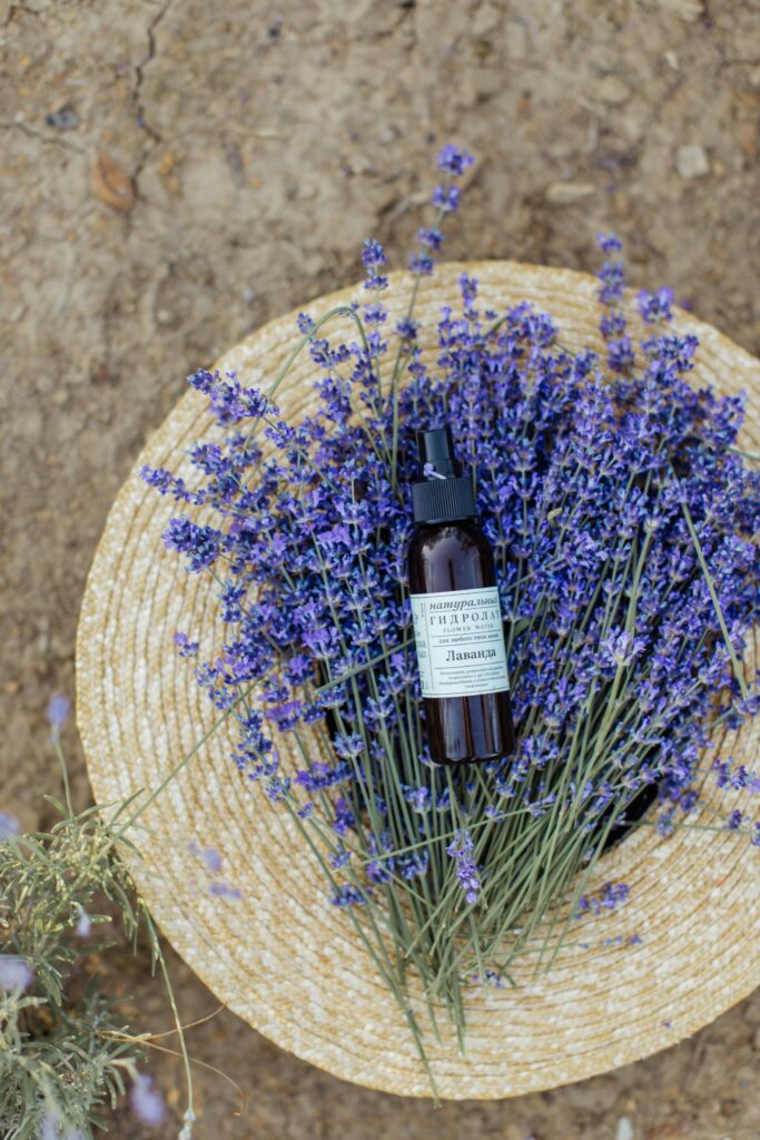 transdermal magnesium glass spray bottle on a bed of lavender 