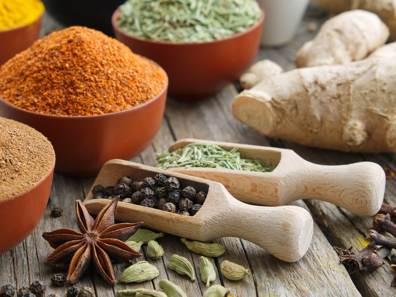 A close-up of a colorful variety of herbs and spices, symbolizing the foundational elements of Ayurvedic healing.