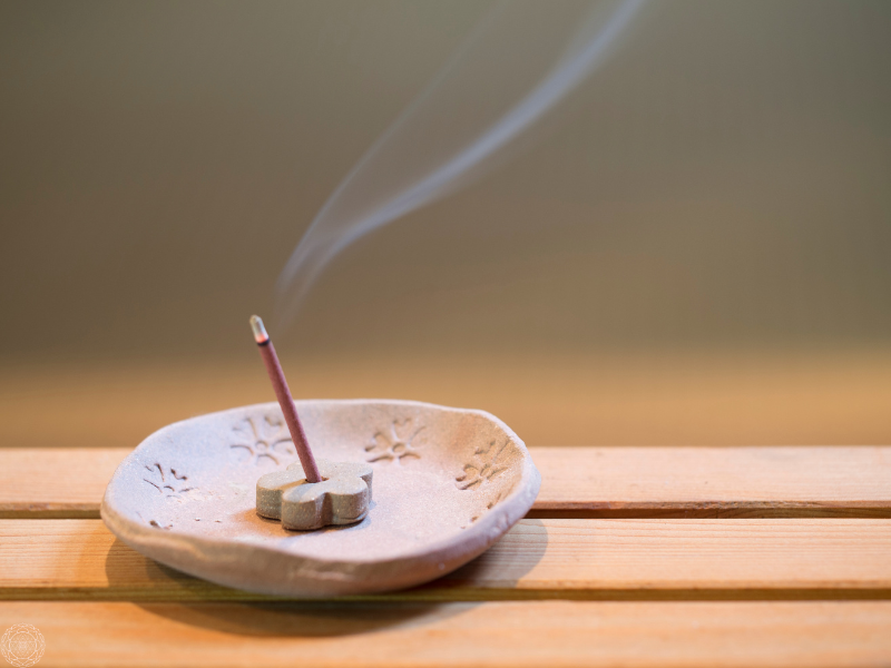 Close-up of incense burning, symbolizing mindfulness and the sacred essence of spiritual awakening.