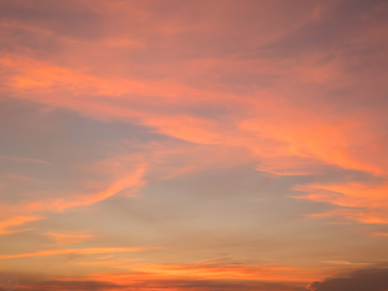 Fiery sky glowing with light, representing cosmic energy and the spiritual essence of starseeds.