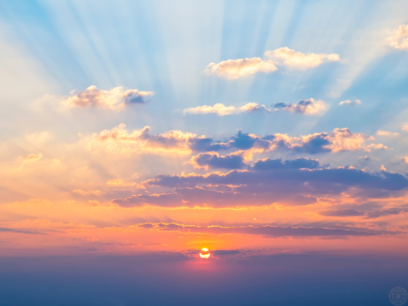 Colorful sky filled with clouds at sunrise, symbolizing the awakening journey of a starseed.